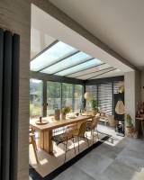 Fabrication et pose d'une véranda en aluminium Technal chez un particulier pour ouvrir une pièce de vie à Aubagne