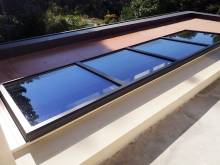 Installation de verrières noires en aluminium de la marque Technal dans une villa au Tholonet